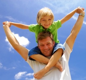 meaning of friendship-small kid on shoulders of big person