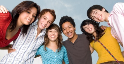 true meaning of friendship -group of teen boys and girls holding arms