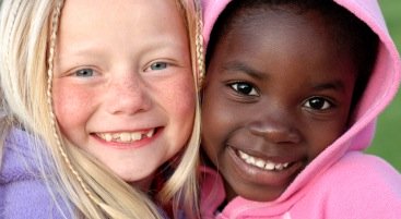 making friends -two young girls smiling